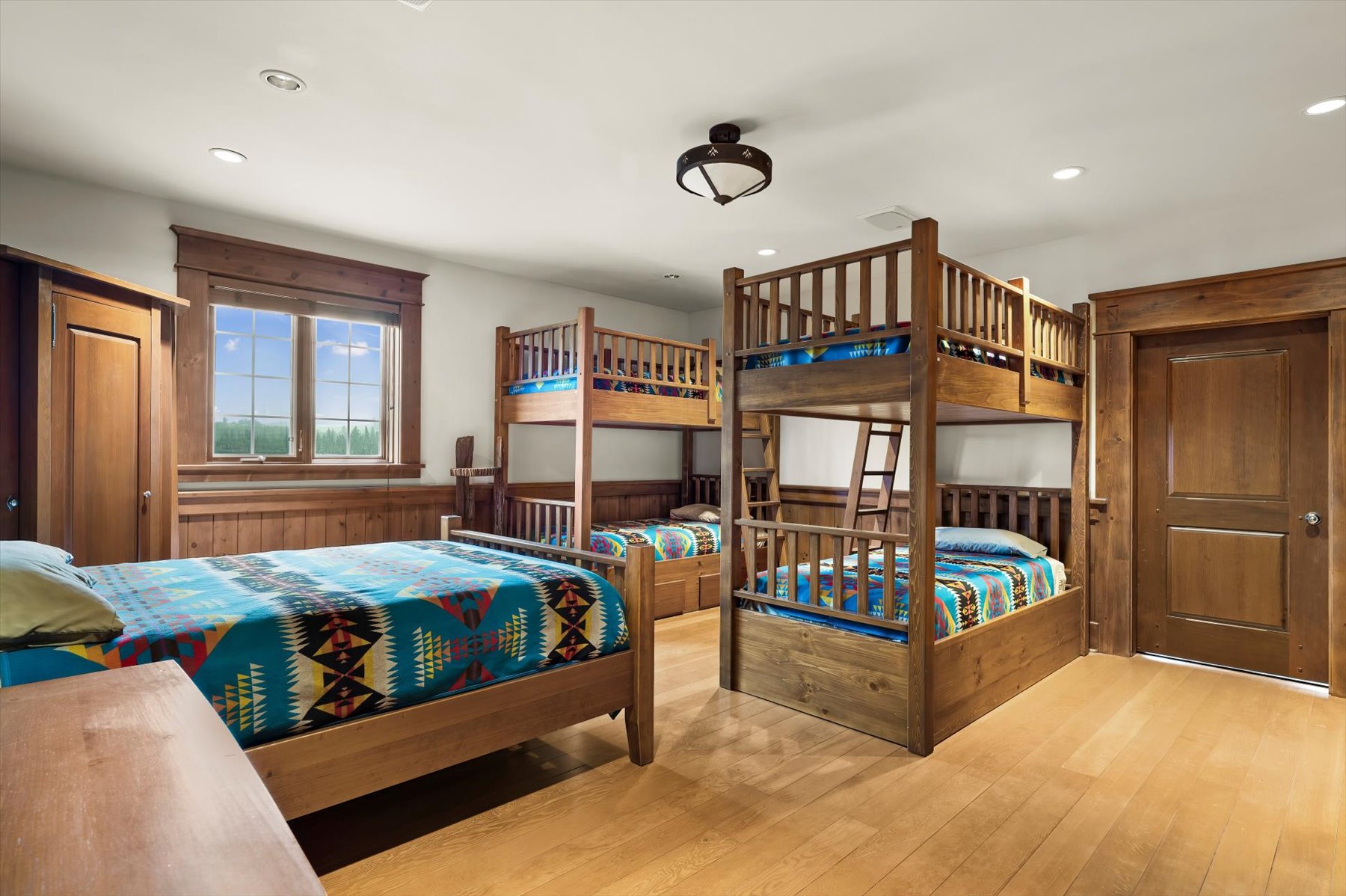 Bunk room with twin bunk beds and Pendleton-pattern bedding